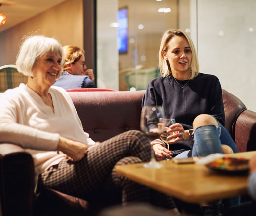 Image of ladies sat relaxing in the Clubroom at David Lloyd Clubs