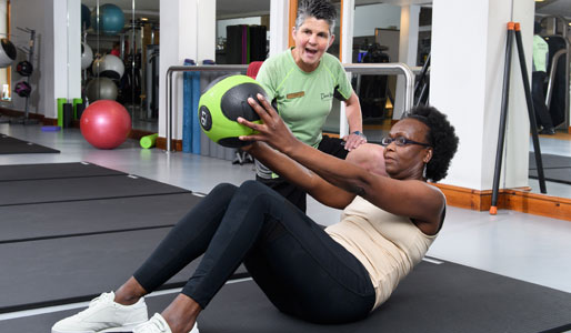 Image of female PT and client with medicine ball